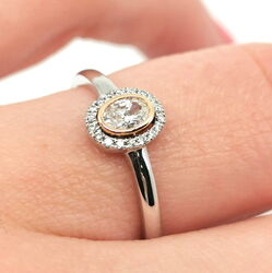 Weißgoldring mit ovalem Diamant und Diamantkranz